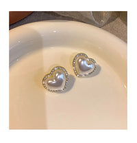 Boucles d'oreilles clous cœur pêche