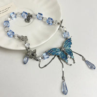 #15 collier papillon en cristal bleu