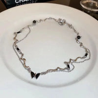 Collier papillon diamant noir