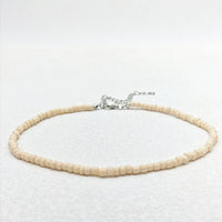 9 (Beige)