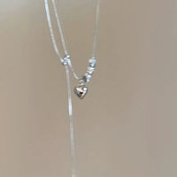 Collier de perles en forme de cœur